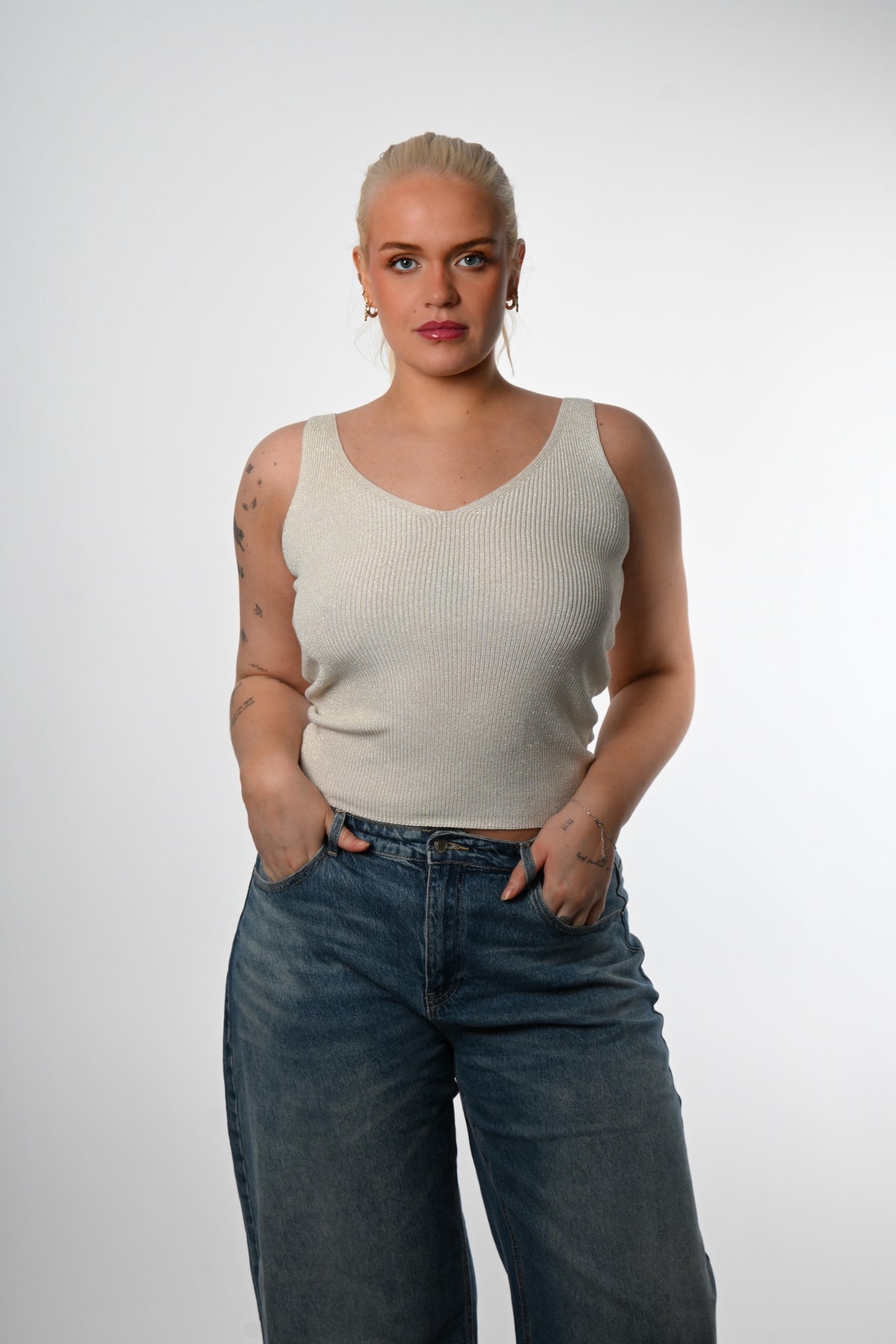 Toppur með glimmerþræði