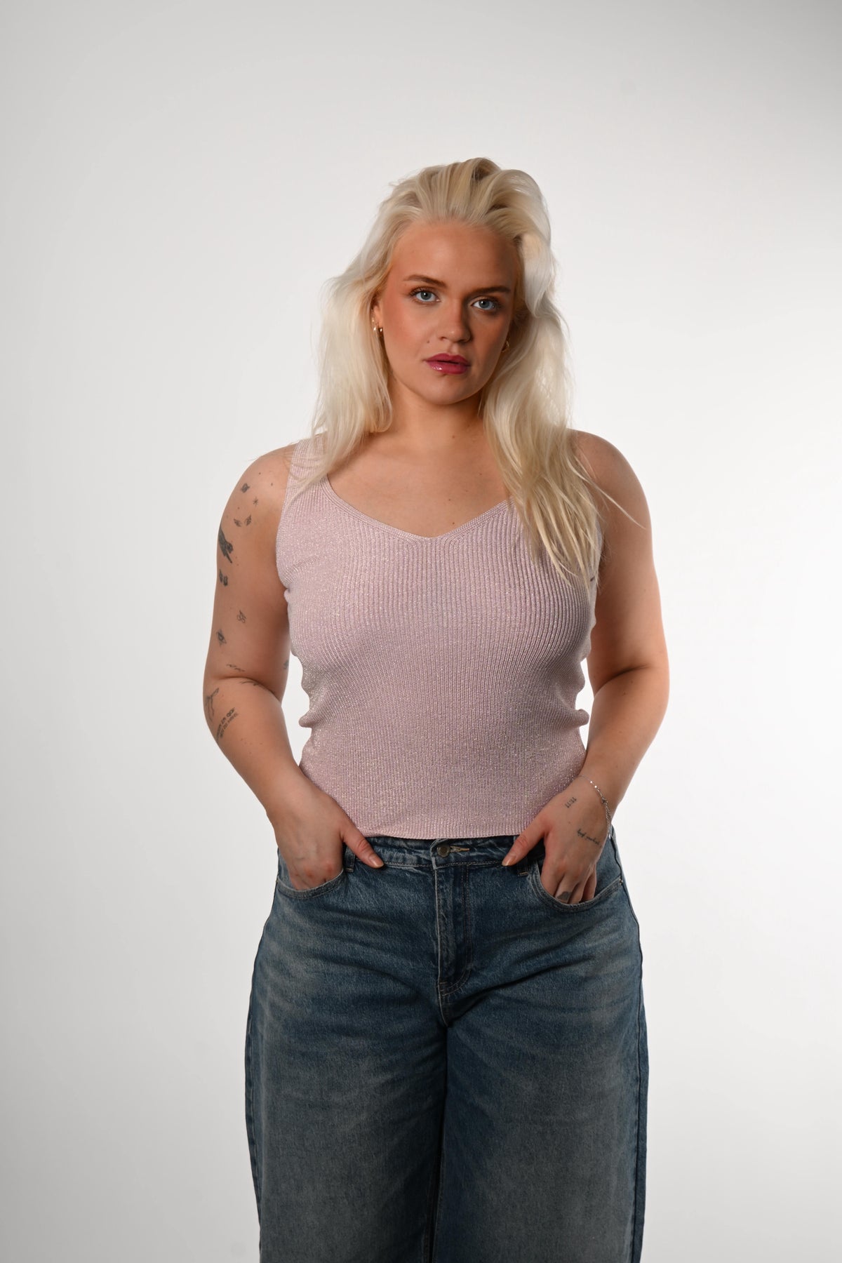 Toppur með glimmerþræði